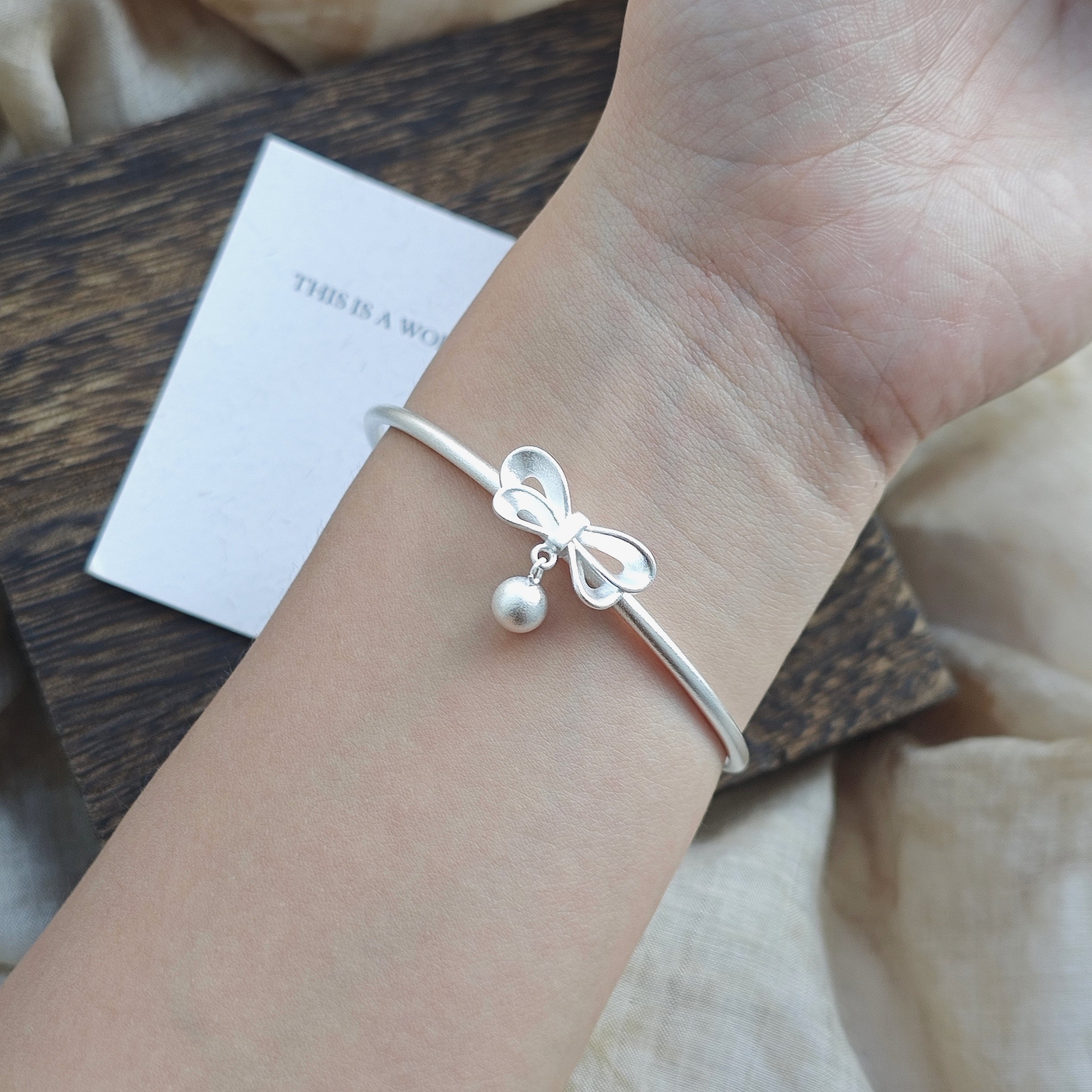 bow bell bracelet